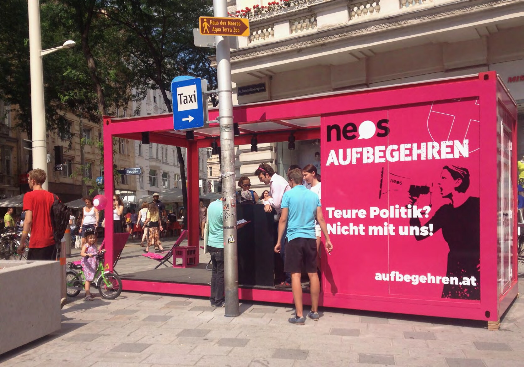 NEOS campaign graphics applied to a Vienna tram shelter